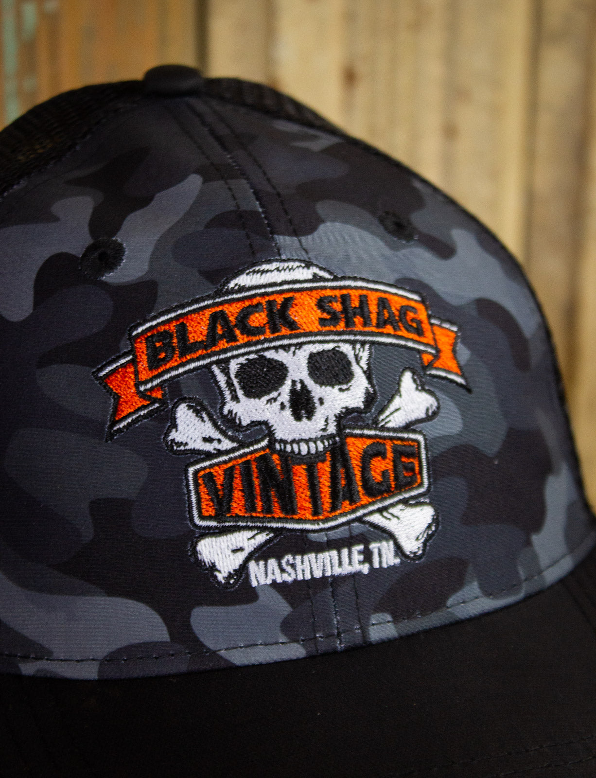 Black Shag Vintage Embroidered Skull + Crossbones Camo Trucker Hat