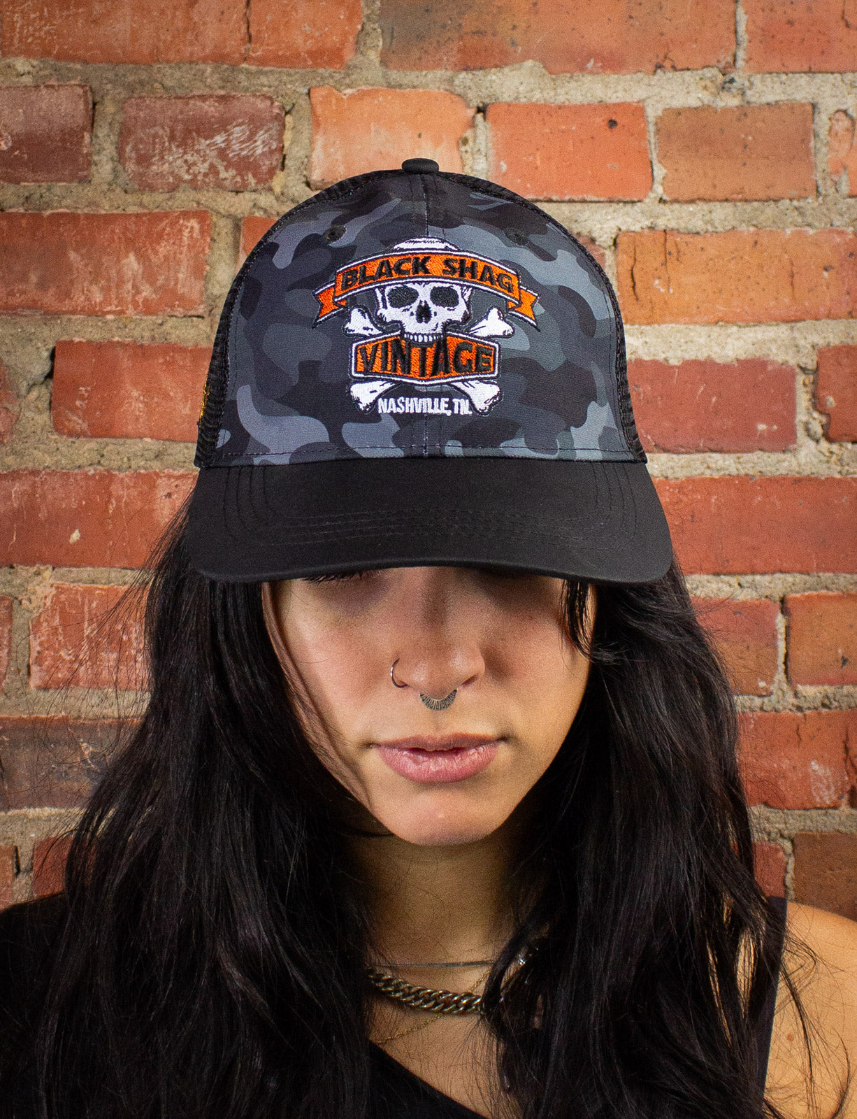 Black Shag Vintage Embroidered Skull + Crossbones Camo Trucker Hat