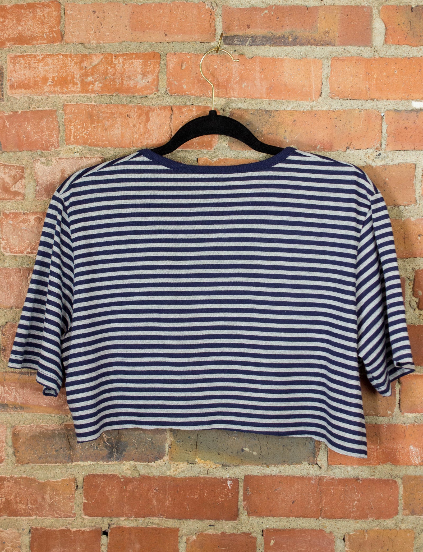 white and navy blue graphic tee